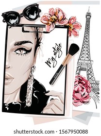 Hand drawn stylish table set with notes, sketches, makeup brush, sunglasses and flowers. Woman face sketch and eiffel tower. Vector illustartion.