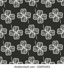 hand drawn stylized shamrock arranged in lines seamless pattern, saint patrick holiday design background, black and white chalkboard vector illustration