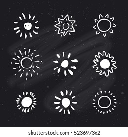 Hand drawn suns on chalkboard background. Sun icon. Stylized sun. Vector Illustration.