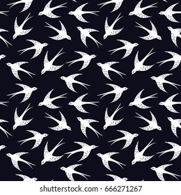 Hand drawn swallow bird seamless pattern. Illustration on dark background. Element for fabric and textile print, wrapping paper, wallpaper, backdrop.