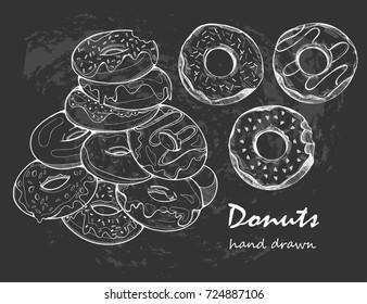 Hand drawn tasty donuts. White graphic vector illustration. Black background. Chalkboard style