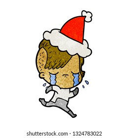 hand drawn textured cartoon of a crying girl wearing space clothes wearing santa hat