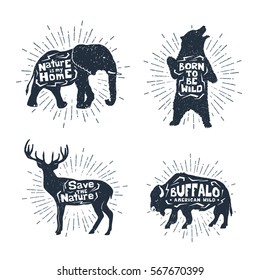 Hand drawn textured vintage badges set with elephant, bear, deer, and buffalo vector illustrations, and inspirational lettering.