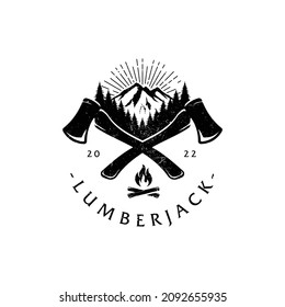 Hand drawn travel badge with crossed axes, mountains and fir trees textured vector illustrations and "Lumberjack" lettering.