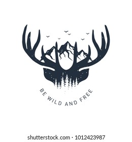 Hand drawn travel badge with deer antlers and mountains textured vector illustration and "Be wild and free" inspirational lettering.