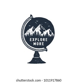 Hand drawn travel badge with mountains in a globe textured vector illustration and "Explore more" inspirational lettering.