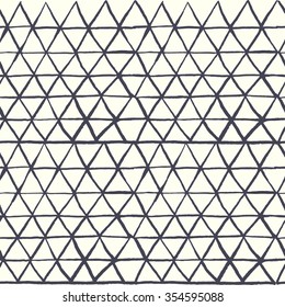 Hand drawn triangles geometric seamless pattern in vector.