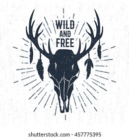 Hand drawn tribal badge with textured deer skull vector illustration and "Wild and free" inspirational lettering.