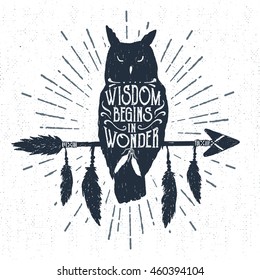 Hand drawn tribal badge with textured owl vector illustration and "Wisdom begins in wonder" lettering.