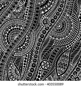 Hand drawn tribal ethnic pattern. Doodle background with doodles, flowers and mandalas. Black and white.