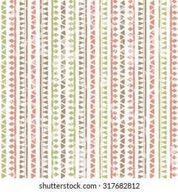 Hand drawn tribal seamless pattern with vertical geometric ornament. Ethnic style. Soft colors (pink, brown, green) and a grunge texture