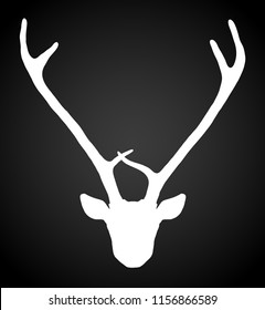 Hand drawn tribal style deer head silhouette. Magic vintage vector illustration in white over black. Spiritual art, yoga, boho style, nature and wilderness. T-shirts and tattoo design.