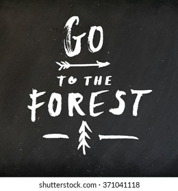 Hand drawn typography design on vintage chalkboard. Hand lettering "Go to the Forest" typography or calligraphy poster on blackboard