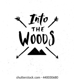 Hand drawn typography design on vintage chalkboard. Hand lettering "Into the Woods" typography or calligraphy poster on blackboard