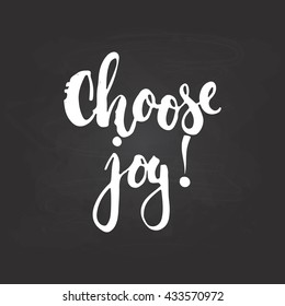 Hand drawn typography lettering phrase Choose joy! isolated on the black chalkboard background. Fun calligraphy for typography greeting and invitation card or t-shirt print design.