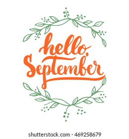 Hand drawn typography lettering phrase Hello, September isolated on the white background with wreath. Fun brush ink inscription for photo overlays, greeting and invitation card or t-shirt print design