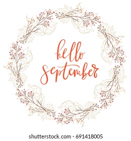 Hand drawn typography lettering phrase Hello September isolated on the white background with wreath for photo, greeting and invitation card or print design