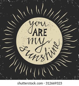 Hand drawn typography poster. Stylish typographic poster design with inscription -you are my sunshine. Inspirational illustration.  Used for greeting cards, posters and print invitations.