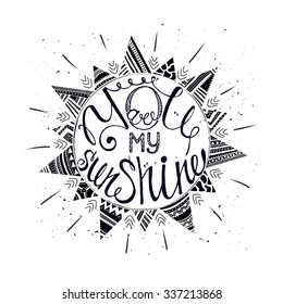 Hand drawn typography poster with sun and tribal ethnic ornament . Conceptual handwritten phrase You are my sunshine.  T shirt hand lettered calligraphic design. Inspirational vector typography.