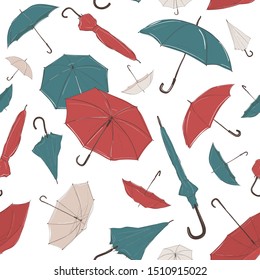 Hand drawn umbrella of different size and from different angles in sketch style. Seamless background with small and big, red, green and white umbrellas of different foreshortening, in careless lines.