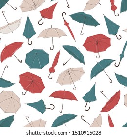 Hand drawn umbrellas from different angles in sketch style. Seamless vector background with red, green and white umbrellas of different foreshortening in chaotic order.