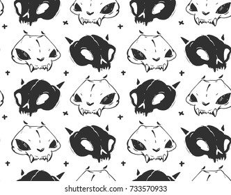 Hand drawn vector abstract artistic freehand textured ink seamless pattern with cat skulls isolated on black background