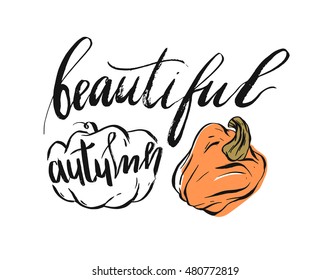 Hand drawn vector abstract autumn illustration with pumpkins and ink handwritten lettering phrase beautiful autumn isolated on white background.