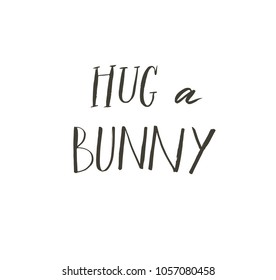 Hand drawn vector abstract graphic scandinavian Happy Easter cute greeting card template with Hug a bunny calligraphy lettering phases text isolated on white background.