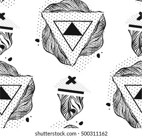 Hand drawn vector abstract graphic ink seamless pattern of triangles,tropical palm leaves,crosses and polka dot textures isolated on white background.Unusual hipster pattern.