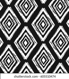 Hand drawn vector abstract rough hand made rhombus seamless pattern in black and white colors.Tribal ethnic ornament decoration.Freehand textures.