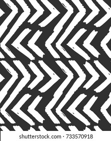 Hand drawn vector abstract rough geometric monochrome seamless zig zag chevron pattern in black and white colors.Hand made grunge brush painted texture.Scandinavian concept design for fashion,fabric