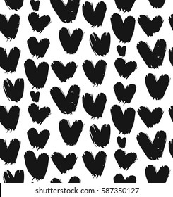 Hand drawn vector abstract seamless pattern with black and white hearts isolated.Design for Valentines day,wrapping,fashion,wedding,birthday,bride,decoration,journaling,business