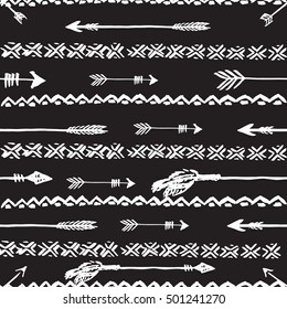 Hand drawn vector arrows and tribal elements. Seamless pattern. Native background.