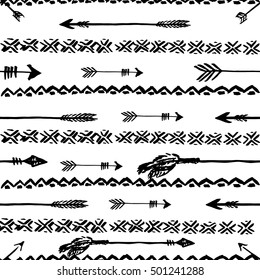 Hand drawn vector arrows and tribal elements. Seamless pattern. Native background.
