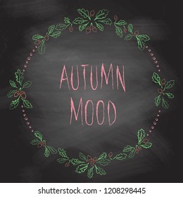 Hand drawn vector autumn wreath with oak leaves and acorns drawn with colored chalks on blackboard