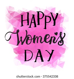 Hand drawn vector black ink  lettering "Women's day" on pink triangle background.