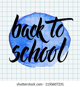 Hand drawn vector brush lettering Back to School words over blue watercolor circle on a chequered notebook page background.