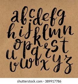 Hand drawn vector calligraphic English alphabet written with brush pen. Craft background