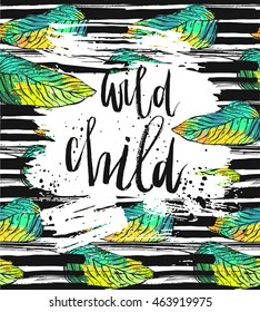 Hand drawn vector card template with ink lettering phase Wild Child on brush stroke textured background and tropical green palm leafs.
