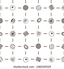 Hand drawn vector collection chocolate candies. Vector bonbon seamless pattern. Background with milk, dark and white chocolate pralines.  Vector isolated cocoa production. Outline Background