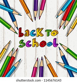 Hand drawn vector doodle Back to School multicolor words and a bunch of color pencils over light wood table background.