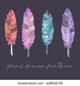 Hand drawn vector feathers for your design. Boho style. Hippie and tribal sketched elements.