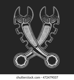 Hand drawn vector icon of spanners on blackboard