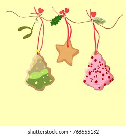 Hand drawn vector illustration of Christmas ornamens - star and christmas trees cookies hanging