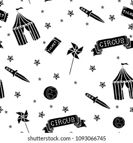 Hand drawn vector illustration of crazy creepy cartoon circus items: wind spinners, daggers, tickets, balls, tents. Seamless pattern on a white background.