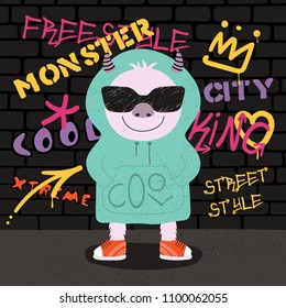 Hand drawn vector illustration of a cute funny monster in sunglasses and hoodie with a wall with graffiti in the background. Isolated objects. Concept for children print.