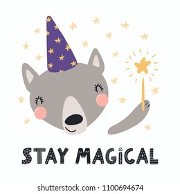 Hand drawn vector illustration of a cute funny wolf in a wizard hat, holding magic wand, with lettering quote Stay magical. Isolated objects. Scandinavian style flat design. Concept for children print