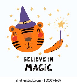 Hand drawn vector illustration of a cute funny tiger in a witch hat, holding magic wand, with lettering Believe in magic. Isolated objects. Scandinavian style flat design. Concept for children print.