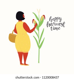 Hand drawn vector illustration of a cute funny beautiful woman picking corn, with lettering quote Happy Harvest Time. Isolated objects on white background. Flat style design. Concept autumn harvest.