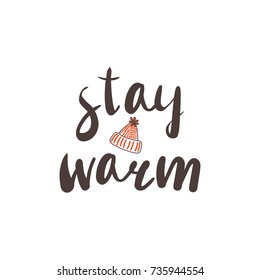 Hand drawn vector illustration with a quote "Stay warm" and knitted hat with a pompom. Isolated objects on white background. Design concept winter, autumn, children.